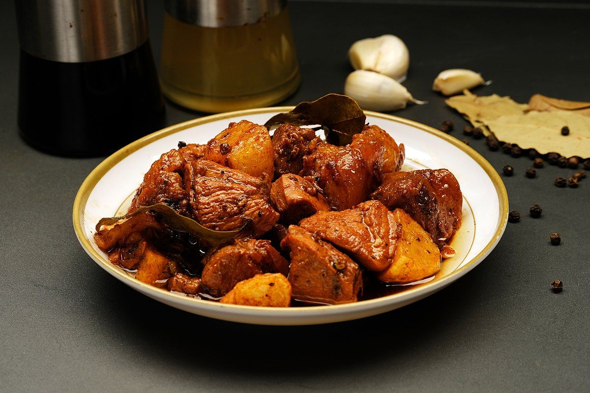 A flavorful meat dish served with rice 